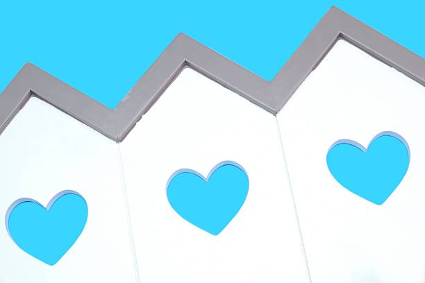 House Model With Windows In The Shape Of A Heart White Small House Wooden Model With Three Windows In The Shape Of A Heart Isolated On The Light Blue Background, Close Up menage trois stock pictures, royalty-free photos & images