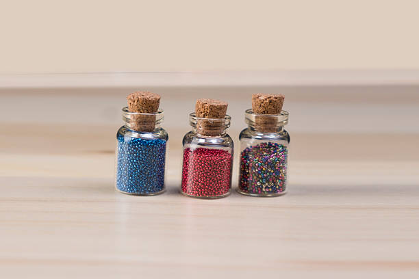 istock Tiny glass bottles filled with a rainbow colors 510684698