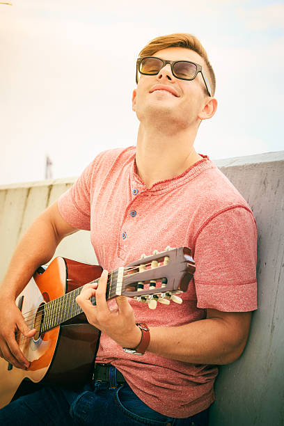 istock Trendy guy with guitar outdoor 510685442