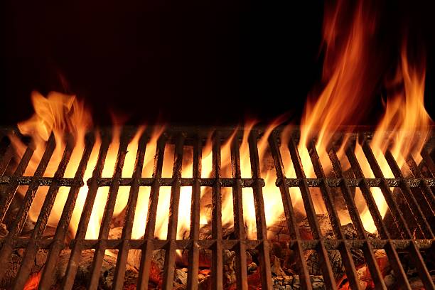 istock Empty Flaming Barbecue Grill Isolated On Black Background. 510686450
