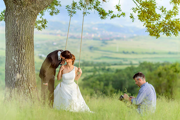 videograph and grooms kissing in nature.