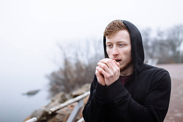 istock Caucasian man warming hands in city 510690152
