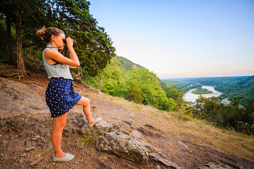 Pretty girl outlooking the scenic view at Delawar Water Gap. Pennsylvania, view to New Jersey's side