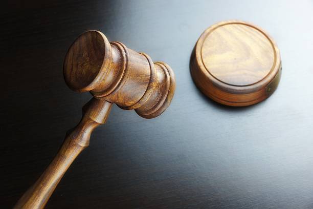 istock Judges Or Auctioneers Walnut Gavel On The Black Table 510690664