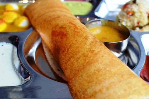 Indian masala dosa combo, served with rava kichadi, idlies and rava kesari
