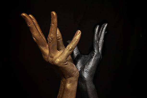 Hands with metallic make-up Male hands with metallic make-up on black background body paint stock pictures, royalty-free photos & images