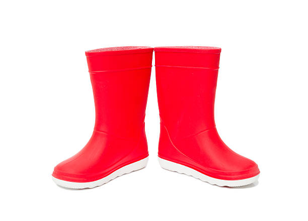 Red  rainboots isolated . Rubber boots for kids. Red  rainboots isolated on white background. Rubber boots for kids. river wear stock pictures, royalty-free photos & images