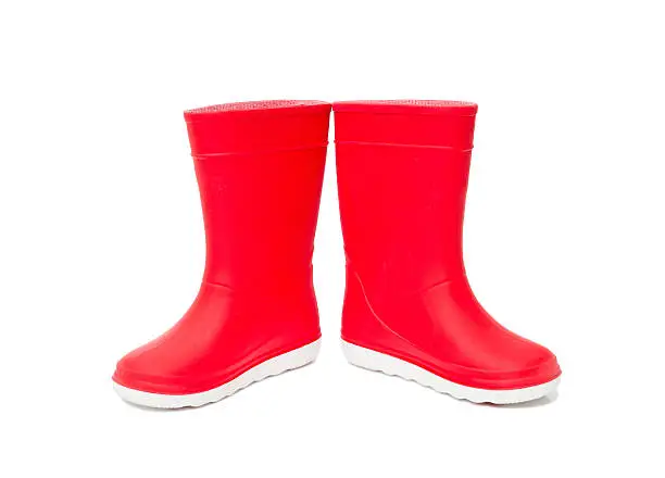Red  rainboots isolated on white background. Rubber boots for kids.