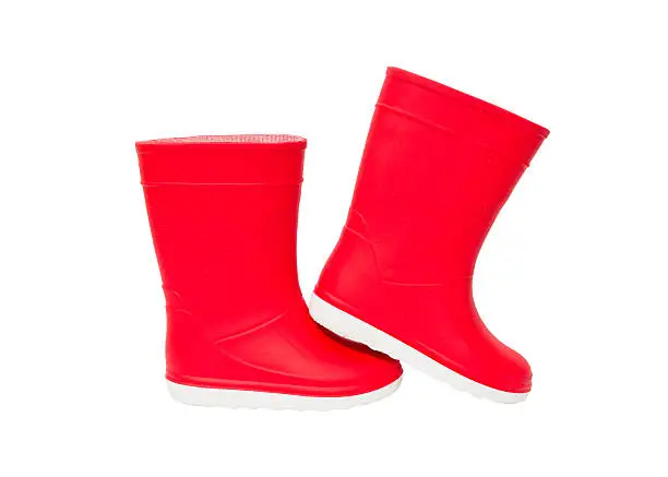 Red  rainboots isolated on white background. Rubber boots for kids.