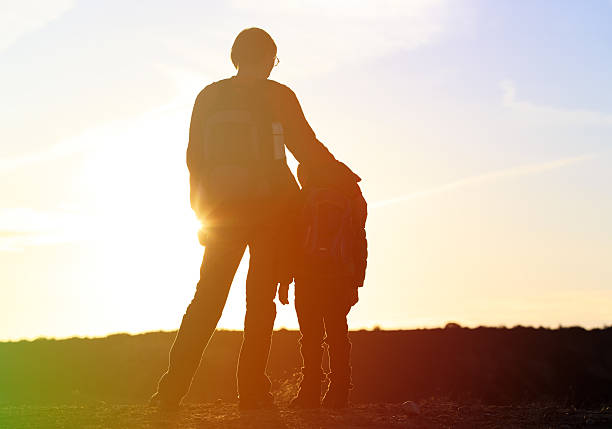 istock father and son travel at sunset 510691444
