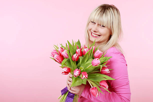 istock Pretty woman with tulips 510693570