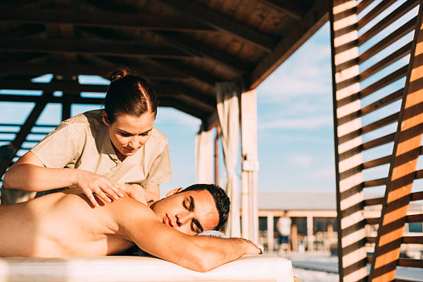 istock Man relaxed during massage outdoor spa 510693915