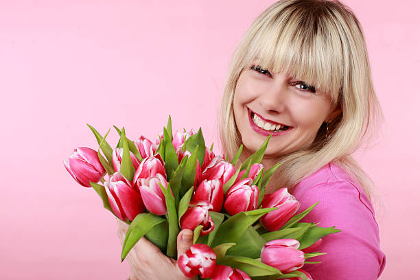 istock Pretty woman with tulips 510693942