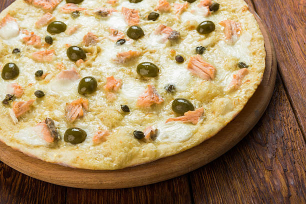 istock Delicious seafood pizza with olives 510694912