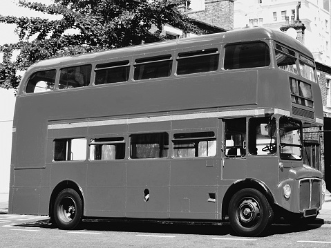 Black and white image of a London Routemaster red double decker bus in London, England, UK