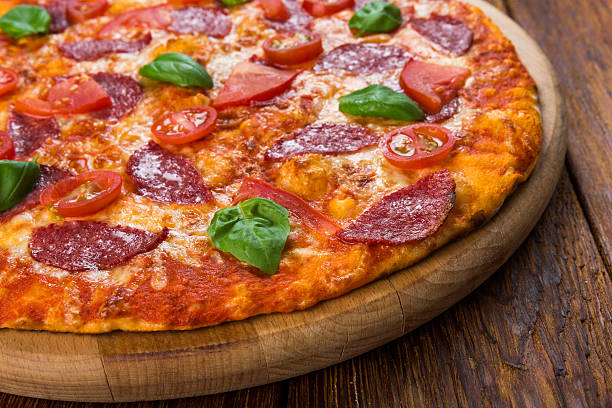istock Delicious pizza with salami and cherry tomatoes 510695706