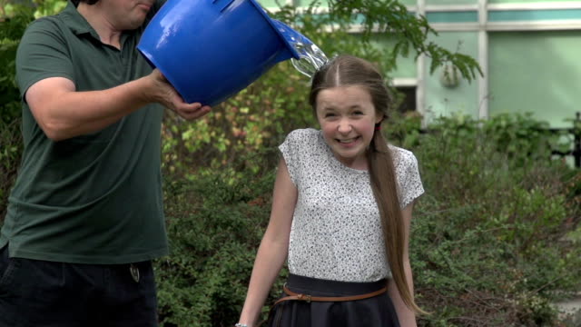 Tween girl take the ice bucket challenge - slow motion