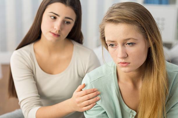 istock Humiliated tenager supporting by friend 510695896