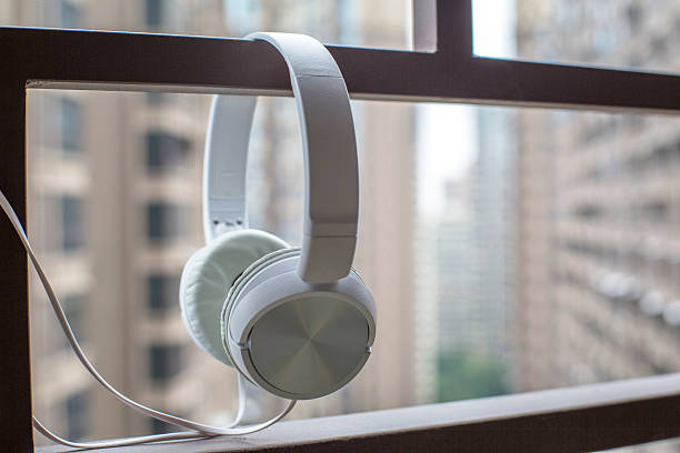 earphone hanging on iron railing of balcony