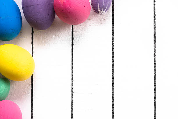 istock Colorful ecological styrofoam Easter eggs on a white wooden background 510696918