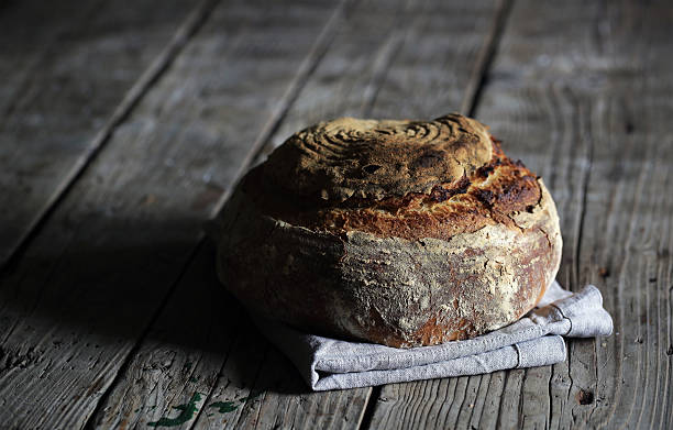 istock Rustic sourdough loaf, artesan bread on wood 510698068