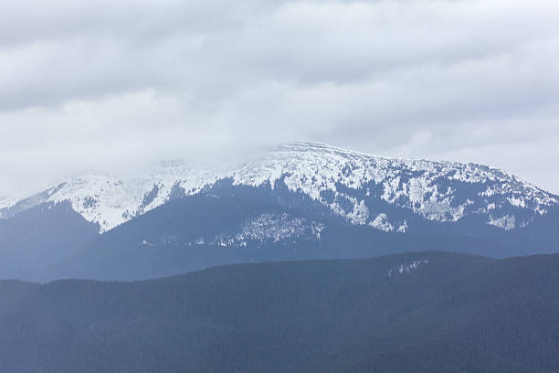 istock snowy peak in the clouds 510698274