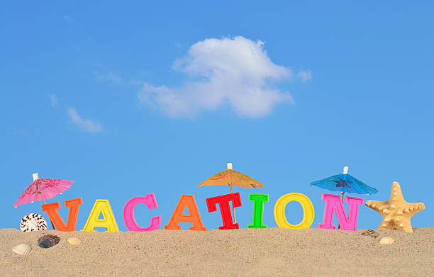 istock Vacation letters on a beach sand 510700582