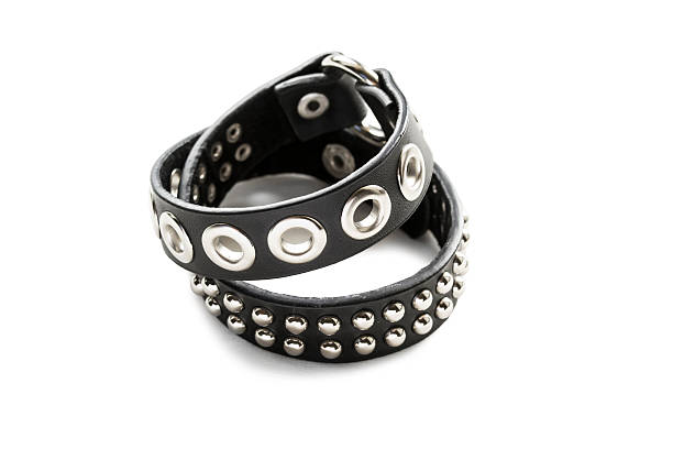 Black leather bracelet with metal rivets isolated over white