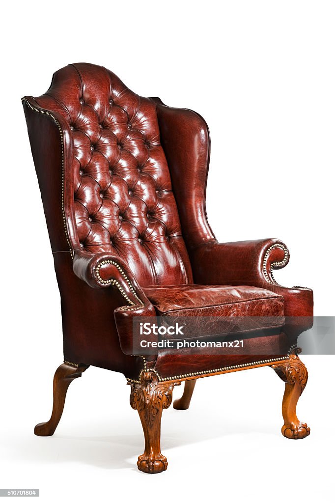 antique leather wing chair carved legs isolated old antique brown/red leather wing arm chair eighteenth or nineteenth century Antique Stock Photo
