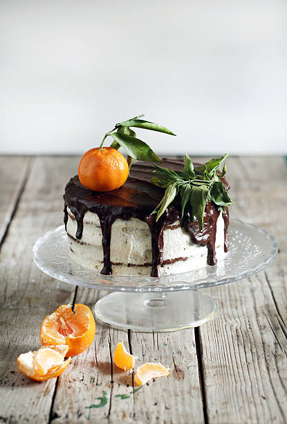 Orange tangerine cake with chocolate and cream stock photo