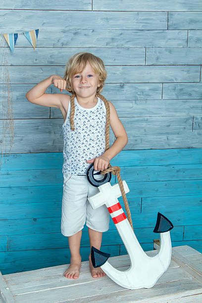 istock child holding anchor 510703880
