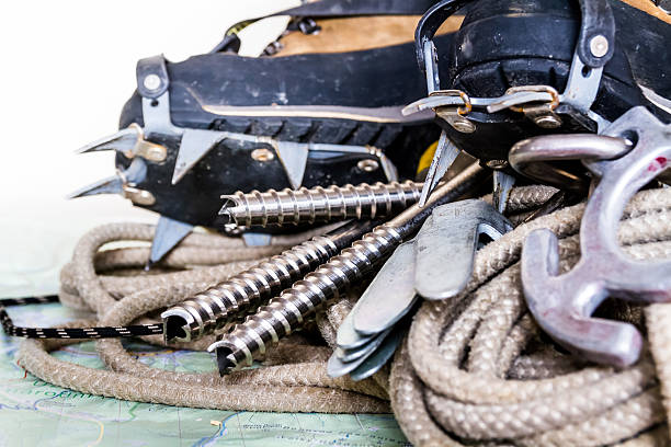 istock Professional climbing gear - rope, ice screws, crampon, boots. 510703882