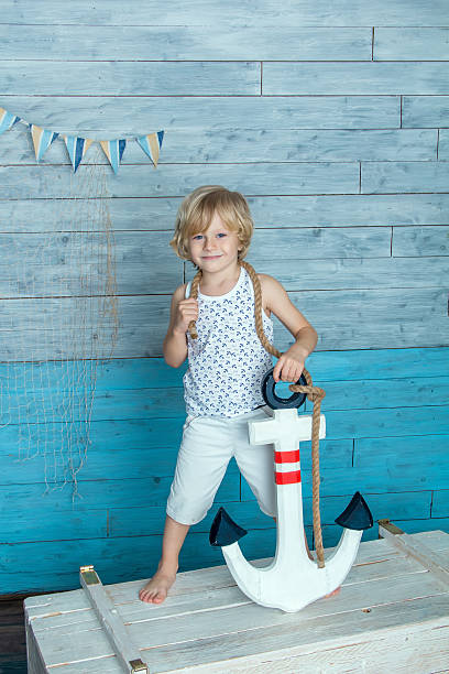 istock child holding anchor 510704084