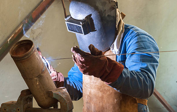 worker welding stock photo