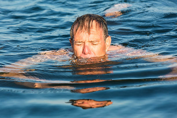 istock Man Swims in Cold Water 510720365