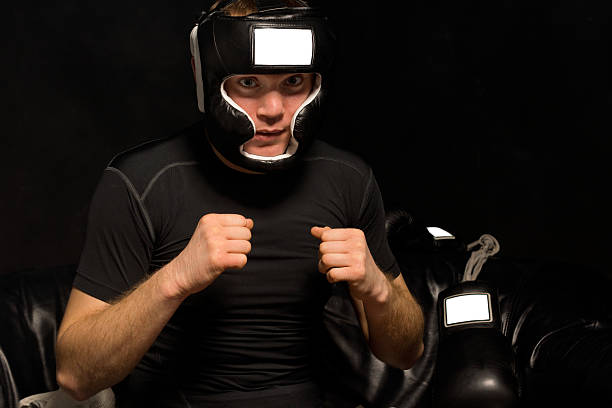 istock Young boxer psyching himself up as he dresses 510722025