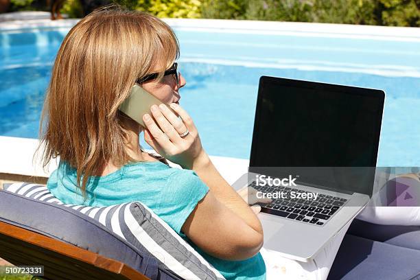 Modern Business Woman Working On Holiday Stock Photo - Download Image Now - Swimming Pool, Businesswoman, One Woman Only