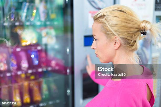 Lady Using A Modern Vending Machine Stock Photo - Download Image Now - Vending Machine, Snack, Food
