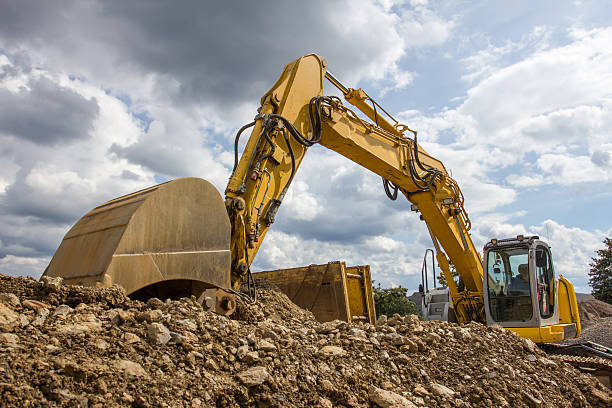 istock excavator in front of a cloudy sky 510723347