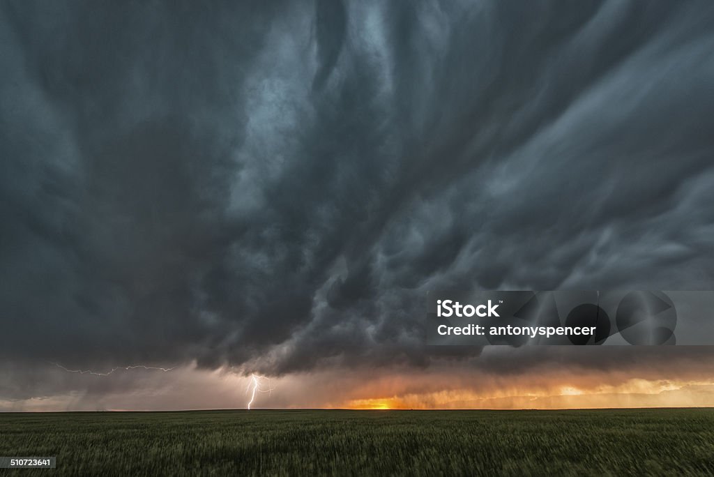 Supercell thunderstorm and mammatus cloud on Tornado Alley A supercell thunderstorm rolls across the Great Plains of the USA in mid summer. Hail Stock Photo