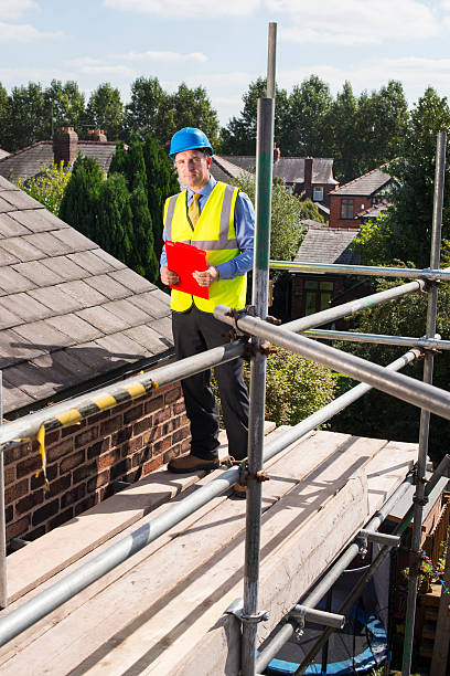 istock building inspector assesses slate roof condition 510723745