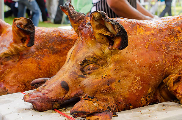 istock Grilled whole roasted pig Spit roasting is a traditional 510724253