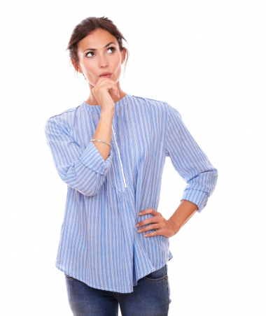 Portrait of stylish adult woman asking herself a question while looking to her left up and standing on isolated white background - copyspace