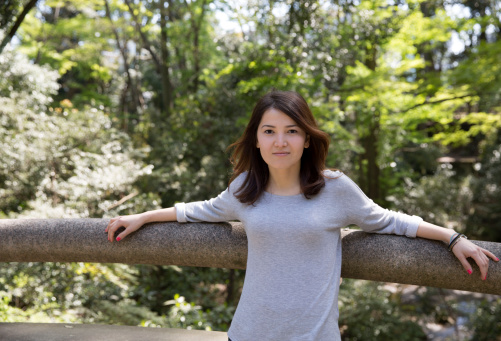 Young woman at the Japanese style bridge
