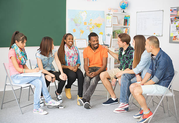 istock Group of students sitting in a circle. 510725271