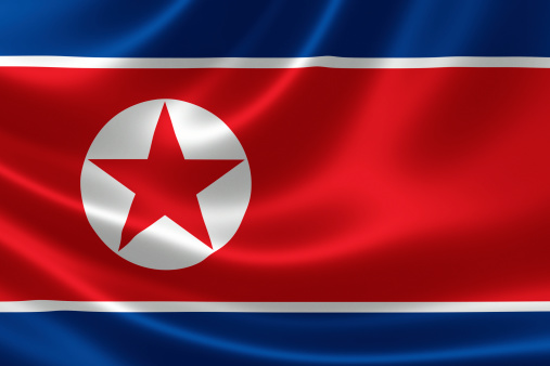 Close-up of the flag of North Korea on satin texture.