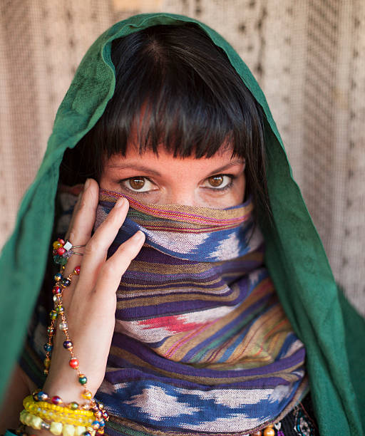 istock Brunette girl covers her face with a veil. Hijab. 510739861