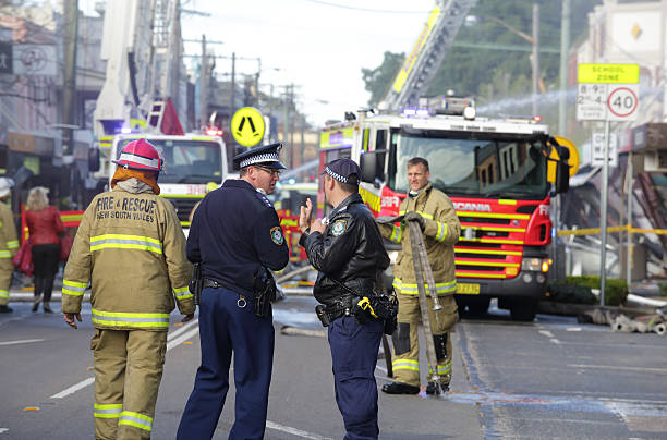 Police and Fire fighters attend blast explosion at shop Rozelle, Australia  - September 4, 2014:  Fire search and rescue teams, police and ambulance crews at a blast site in Rozelle, where three people perished. police and firemen stock pictures, royalty-free photos & images