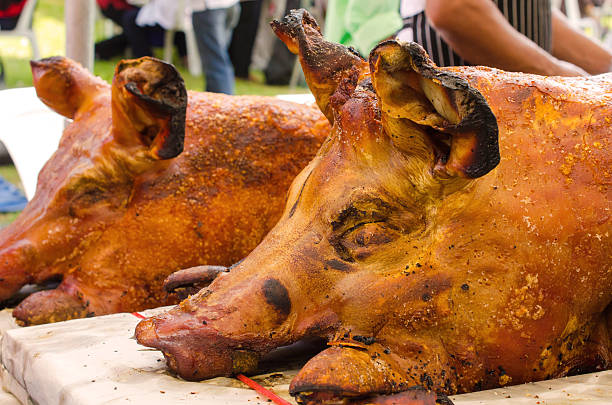 istock Grilled whole roasted pig Spit roasting is a traditional 510742283