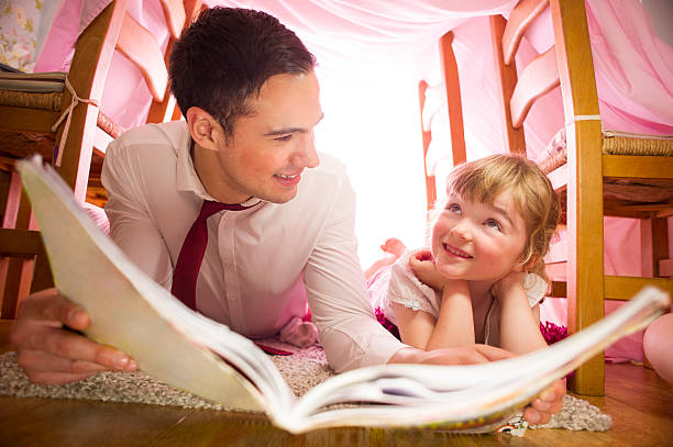 istock father and daughter storytime 510744539